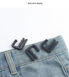 Removable waistband button for trousers photo