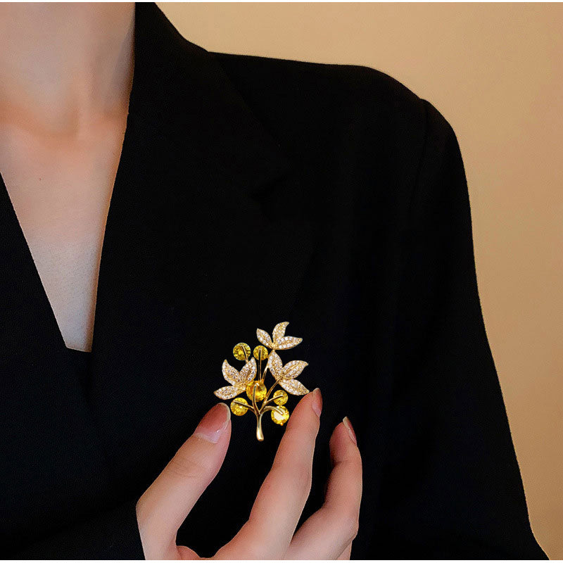 Decorative floral brooch on fabric