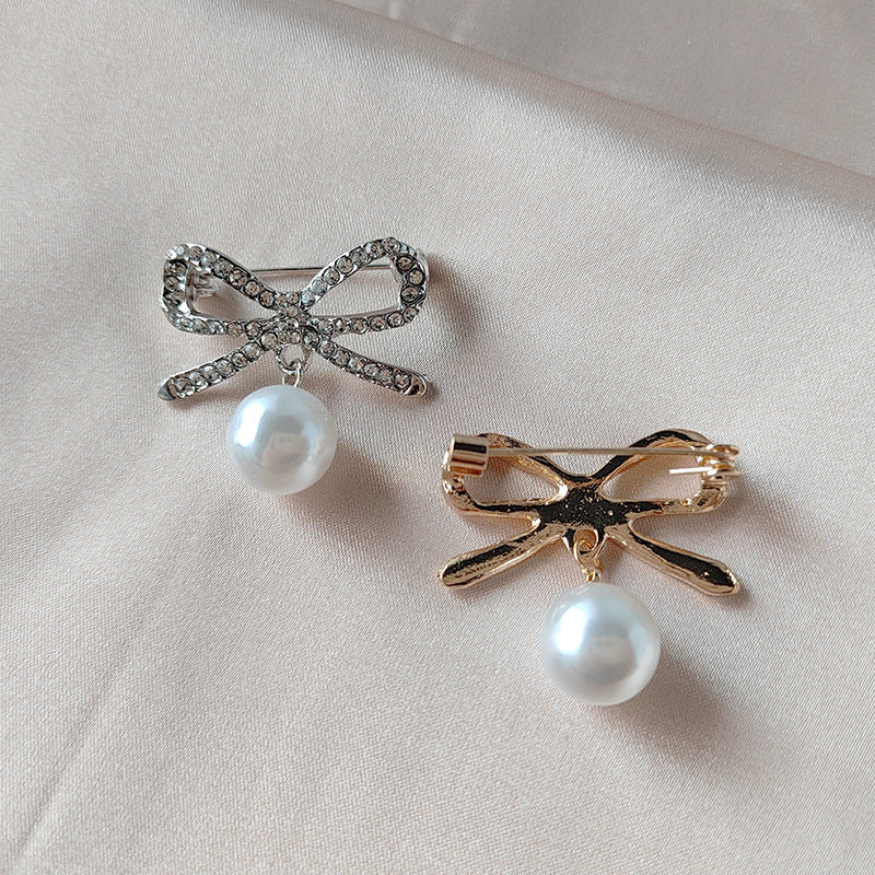 Gold finish butterfly brooch on fabric - Image 3