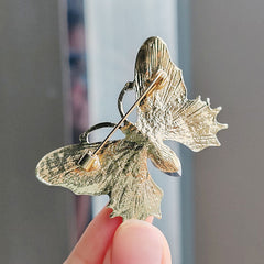Vintage butterfly brooch showcasing colourful enamel