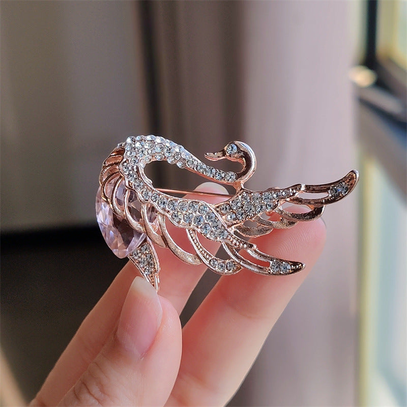 Brooch set against a pastel background for display