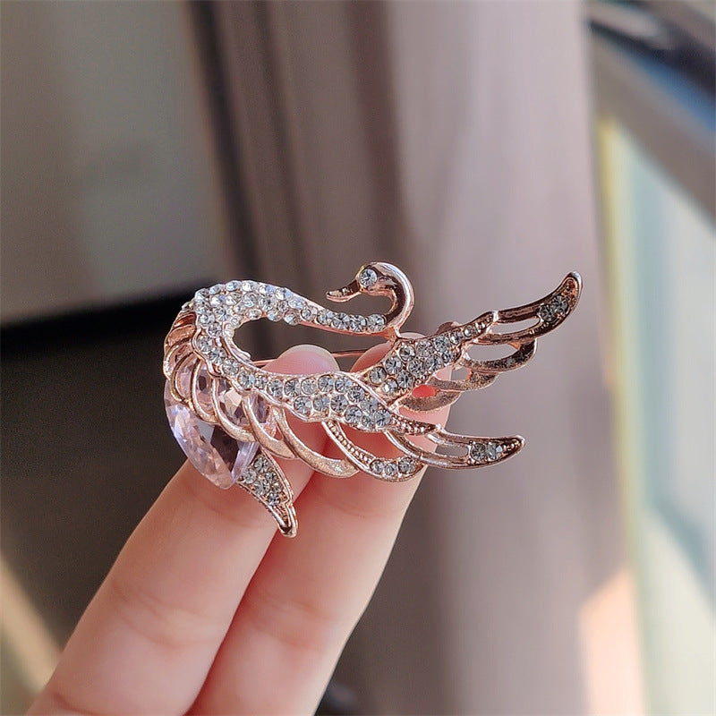 Swan Brooch featured as a trendy outfit accessory