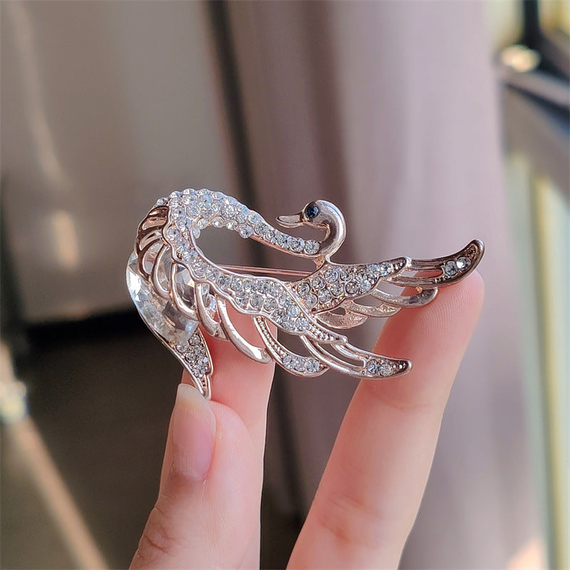 Close-up of Crystal-accented Swan Brooch for women
