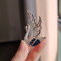 Brooch set against a pastel background for display