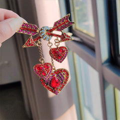 Vintage-inspired Cupid heart arrow pin
