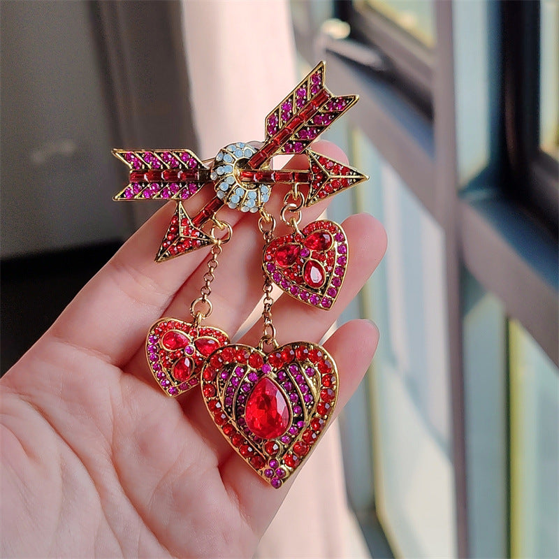 Stylish vintage Cupid heart arrow brooch with tassels