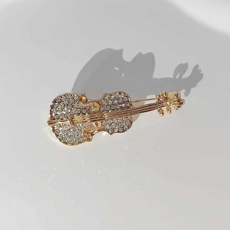 Stylish brooch on a dark background