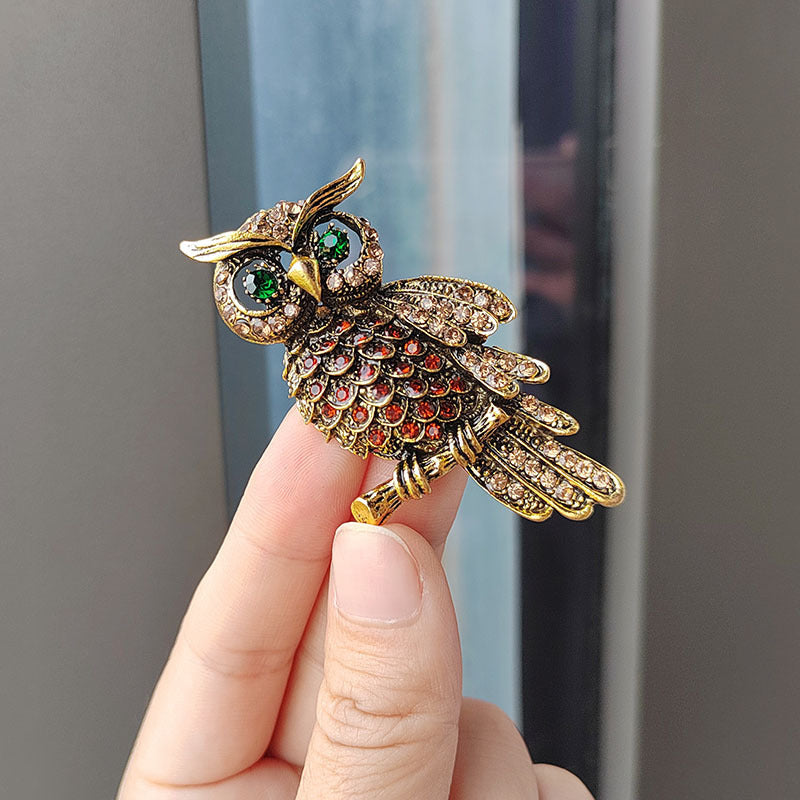 Detailed view of vintage owl brooch crystals
