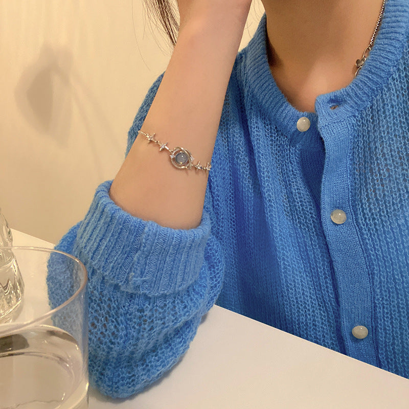 Blue Celestial Bracelet worn on a wrist
