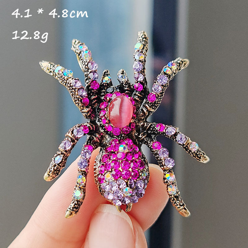 Spooky chrome spider brooch