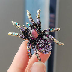 Trendy spider brooch with sparkling cat eye stones