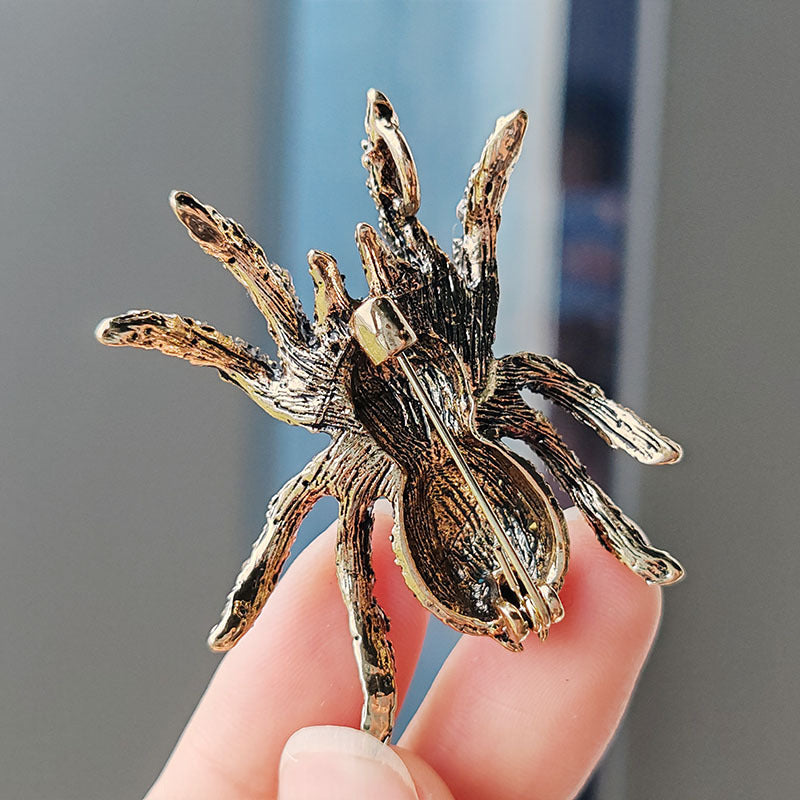 Close-up view of the vintage spider pin design