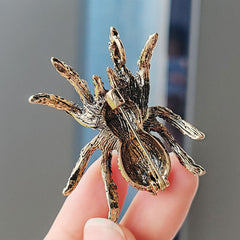 Close-up view of the vintage spider pin design