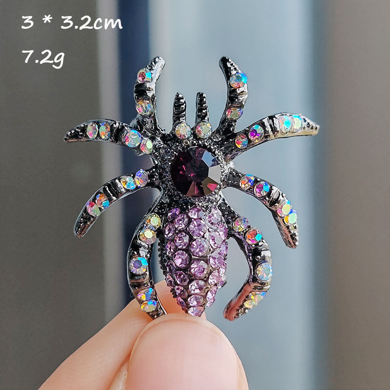 Stylish spider brooch on a blue background