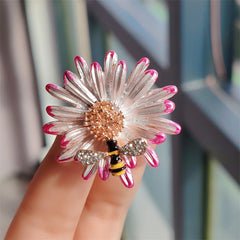 Purple daisy brooch pin displayed elegantly