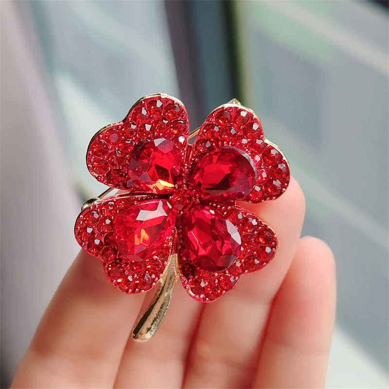 Stylish four-leaf clover pin on a blouse