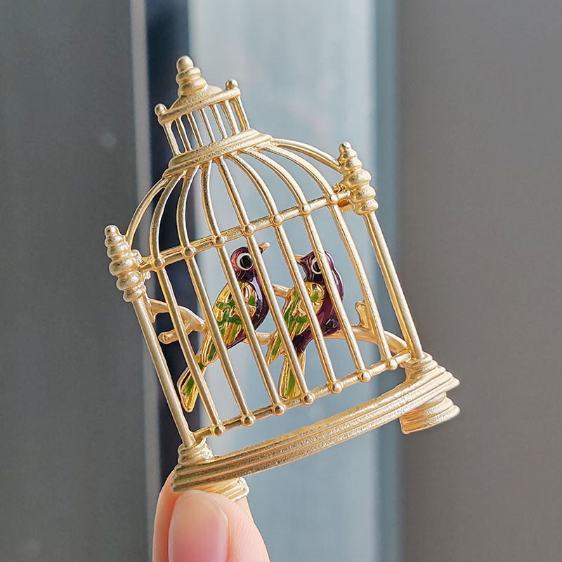 Close-up of the elegant birdcage brooch