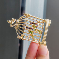 Fashion-forward birdcage brooch pin mode