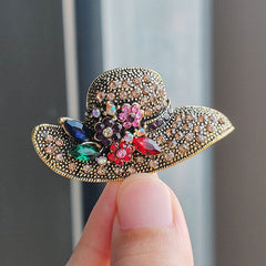 Asymmetrical brooch design with sparkling details