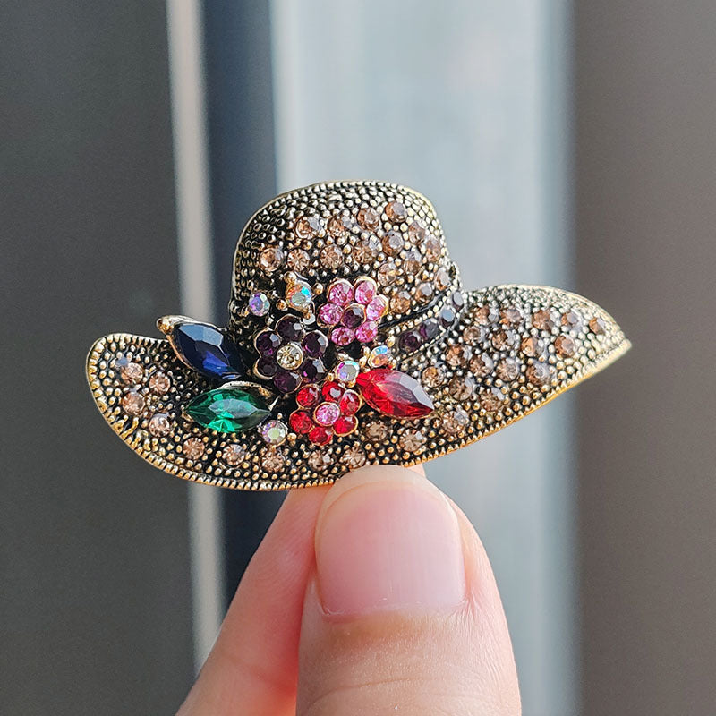 Asymmetrical brooch design with sparkling details