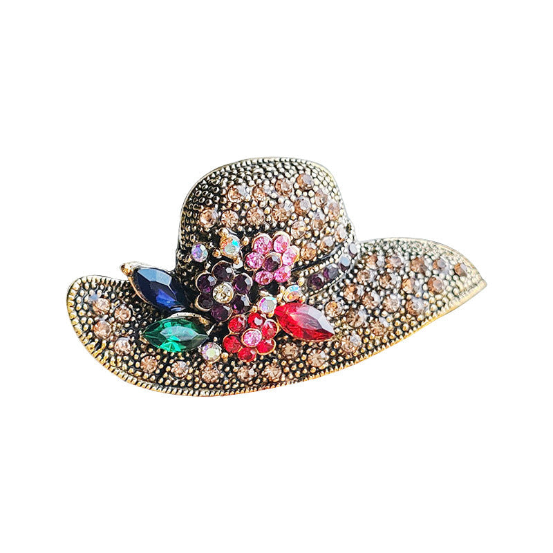 Stylish gold brooch with rhinestones on a bag