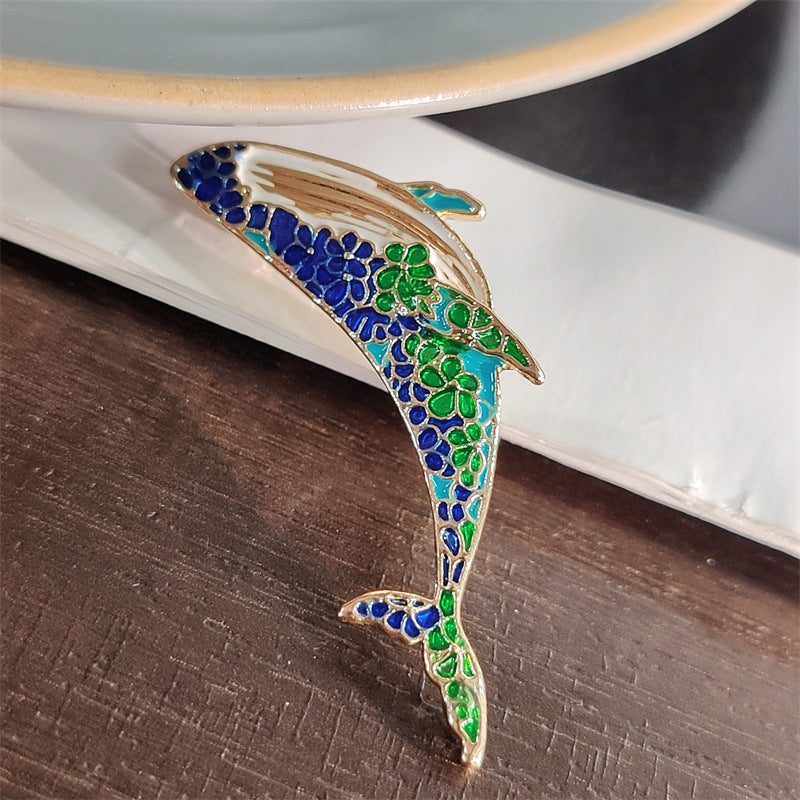 Charming dolphin pin on casual clothing