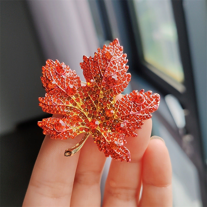 Close-up of Leaf Brooch with Sparkling Crystals