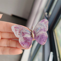 Elegant butterfly brooch on scarf