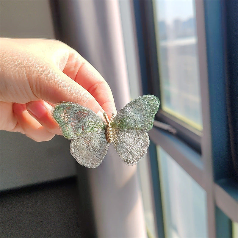 Butterfly brooch shown on a hat