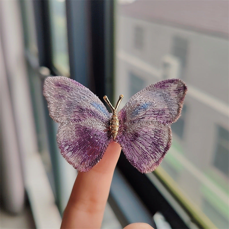 Elegant butterfly brooch on scarf
