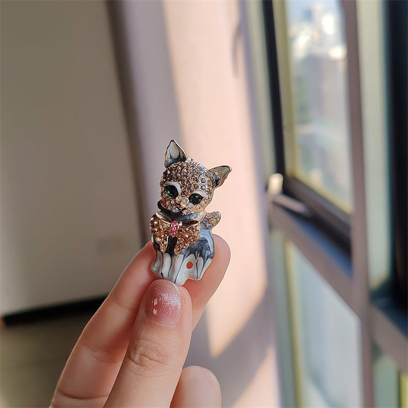 Close-up of the cat-themed brooch design