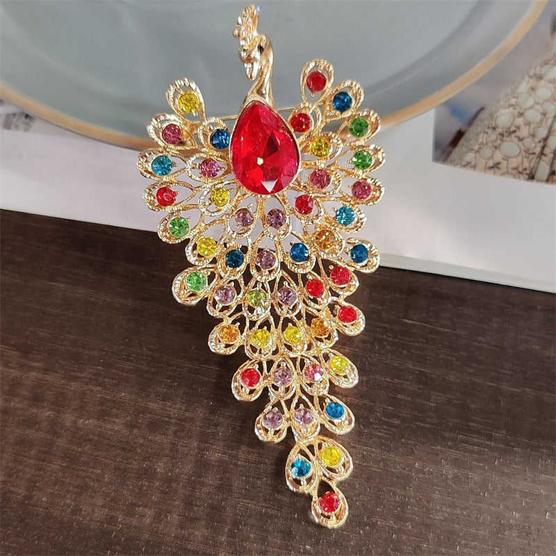 Peacock brooch highlighting rhinestones