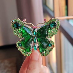 Elegant butterfly brooch worn on a scarf