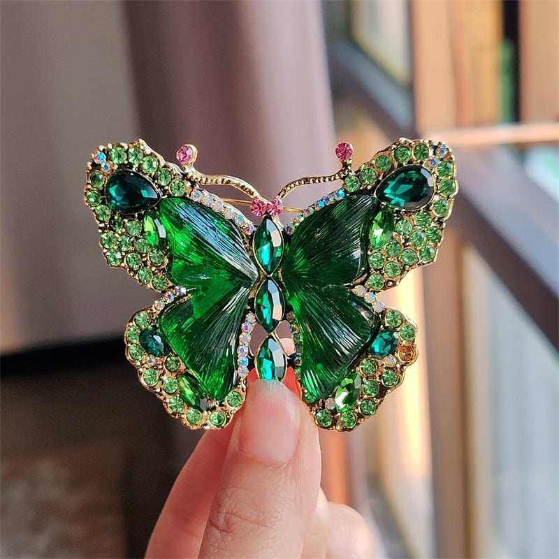 Elegant butterfly brooch worn on a scarf