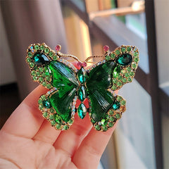 Close-up of crystal butterfly brooch design