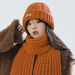 Gray knitted combo of hat and scarf for winter