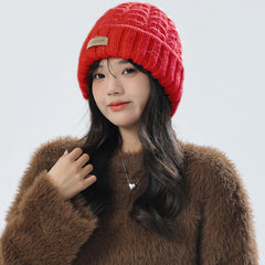 Women wearing a stylish pink knit hat and scarf