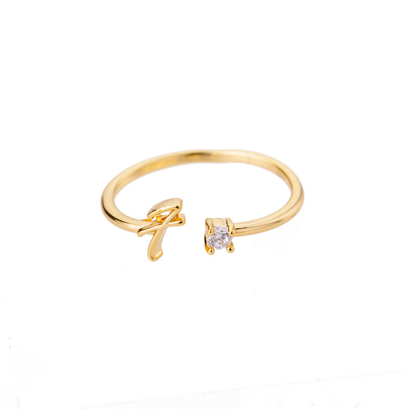 close-up of gold plated alphabet ring