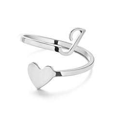 Woman's hand wearing a stylish heart design ring