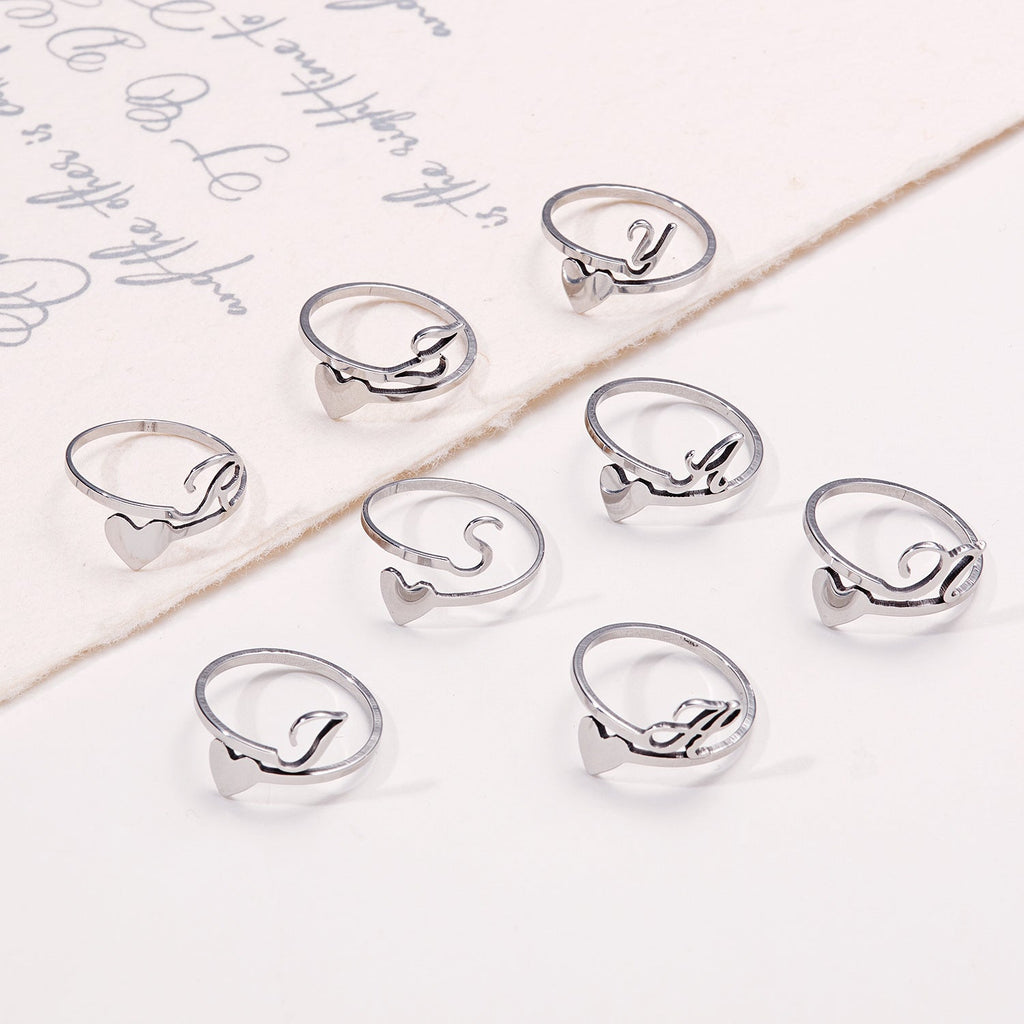Close-up of colourful adjustable letter ring