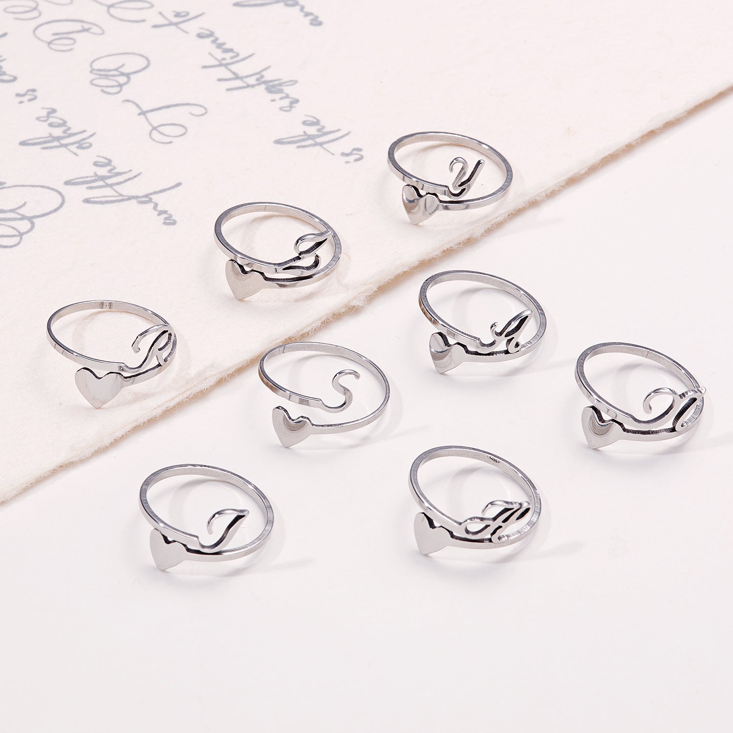 Close-up of colourful adjustable letter ring
