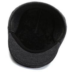 Stylish black duckbill cap worn by model