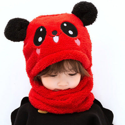 Little girl wearing colourful winter hat and scarf