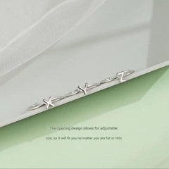 Stylish Adjustable Silver Alphabet Ring on display