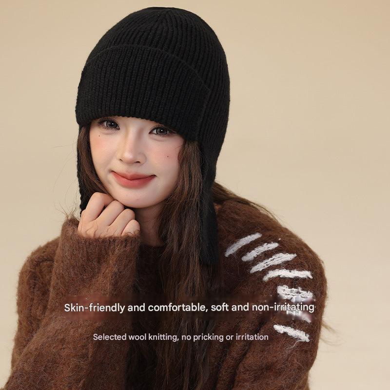 Brown winter beanie and gloves set on display