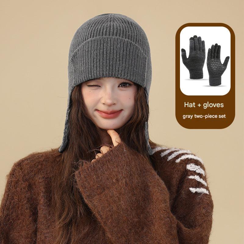 Navy blue beanie and gloves showcased outdoors