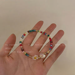 floral necklace on display with features