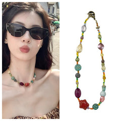 model wearing colourful floral necklace