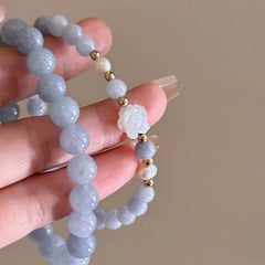 beaded bracelet featuring camellia flowers