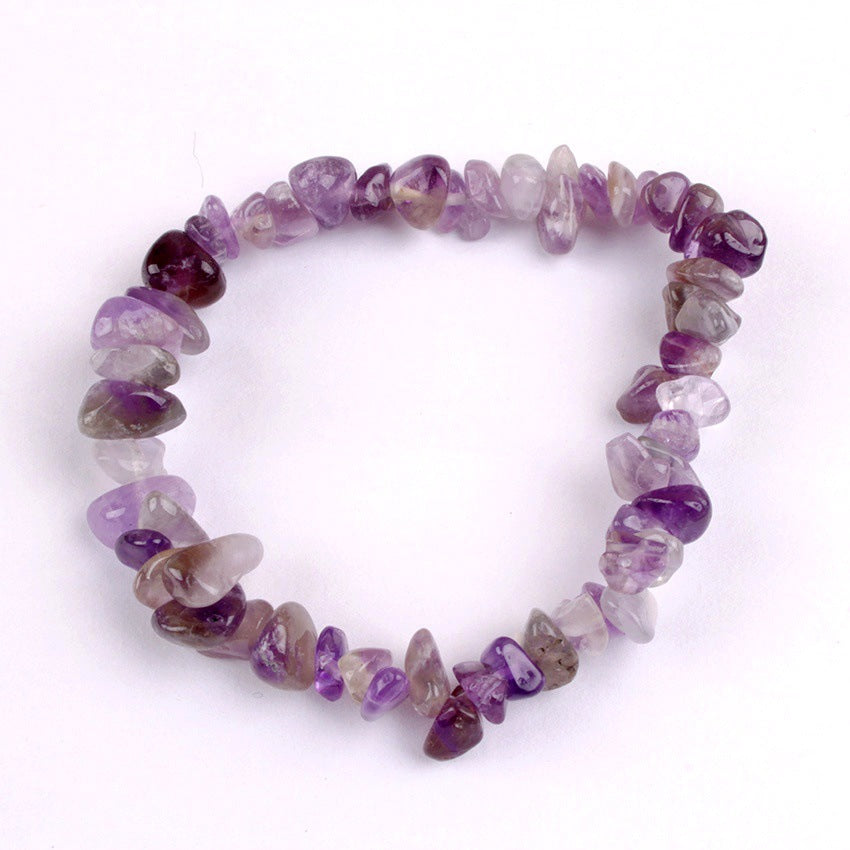 Close-up of colourful crystal charms on bracelet